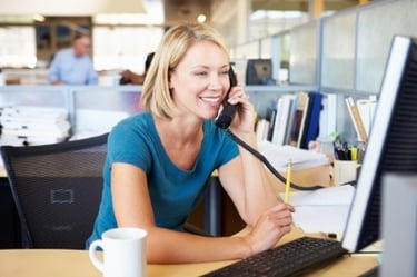 Blonde Woman Calling Business on Telephone