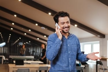 Man Talking on Phone in Office